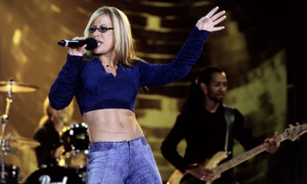 As much a trademark as her powerful voice and tinted prescription glasses … Anastacia bares her midriff while performing.