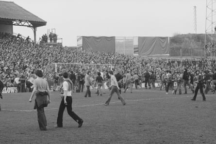 Fans on the pitch during the riot at the Den during the 1978 FA Cup quarter-final between Millwall and Ipswich.