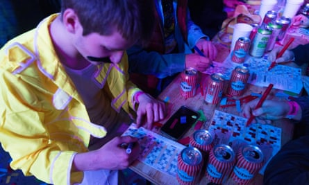 A man dressed in a yellow jacket with a black moustache playing bingo. 