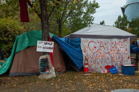 two camps in front of trees