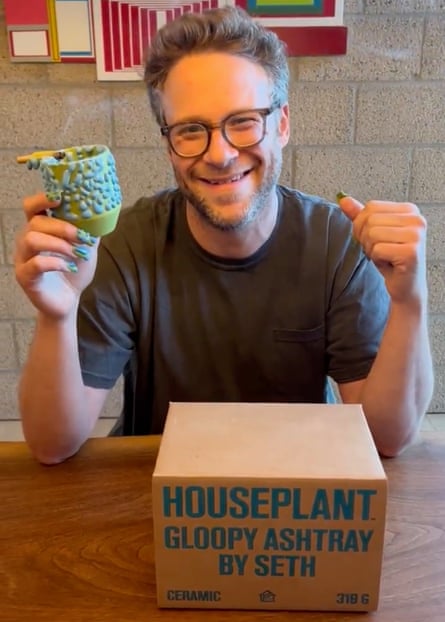 Actor Seth Rogen holding a Gloopy Ashtray from his Houseplant, a business he set up that sells cannabis products and accessories