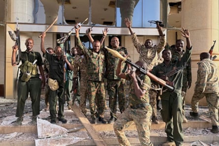 Soldiers celebrate outside the Republican Palace 