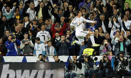 Gareth Bale celebrates one of his two goals for Real Madrid in their cosmopolitan win over Sevilla in 2013.