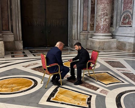 Donald Trump and Volodymyr Zelenskyy sit facing each other