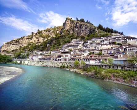 Mountainside houses overlooking a stretch of water
