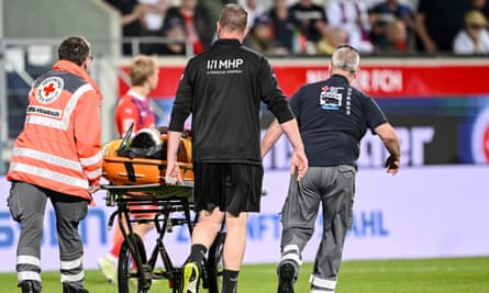Heidenheim’s goalkeeper Kevin Müller is carried off on a stretcher after colliding with Bochum’s Ibrahima Sissoko.