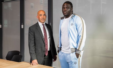 Ade Adedeji stands with Keir Monteith