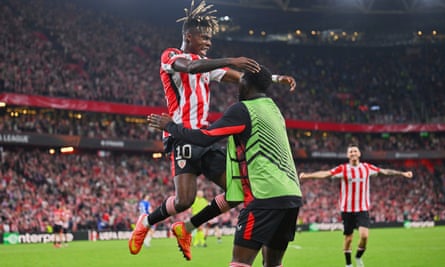 Athletic Bilbao’s Nico Williams, left, leaps into the arms of his brother Iñaki to celebrate scoring in the home leg against Rangers