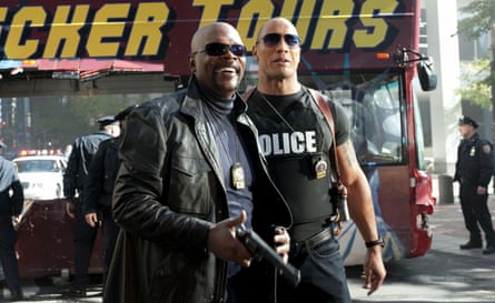 He and Jackson smile, wearing off-duty cop clothes and NYC police badges