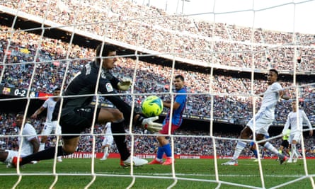 Barcelona's Sergio Aguero scores their first goal past Real Madrid's Thibaut Courtois on 24 October 2021.