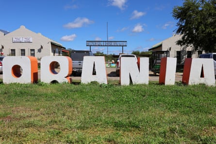 The Orania town sign outside a shopping centre.